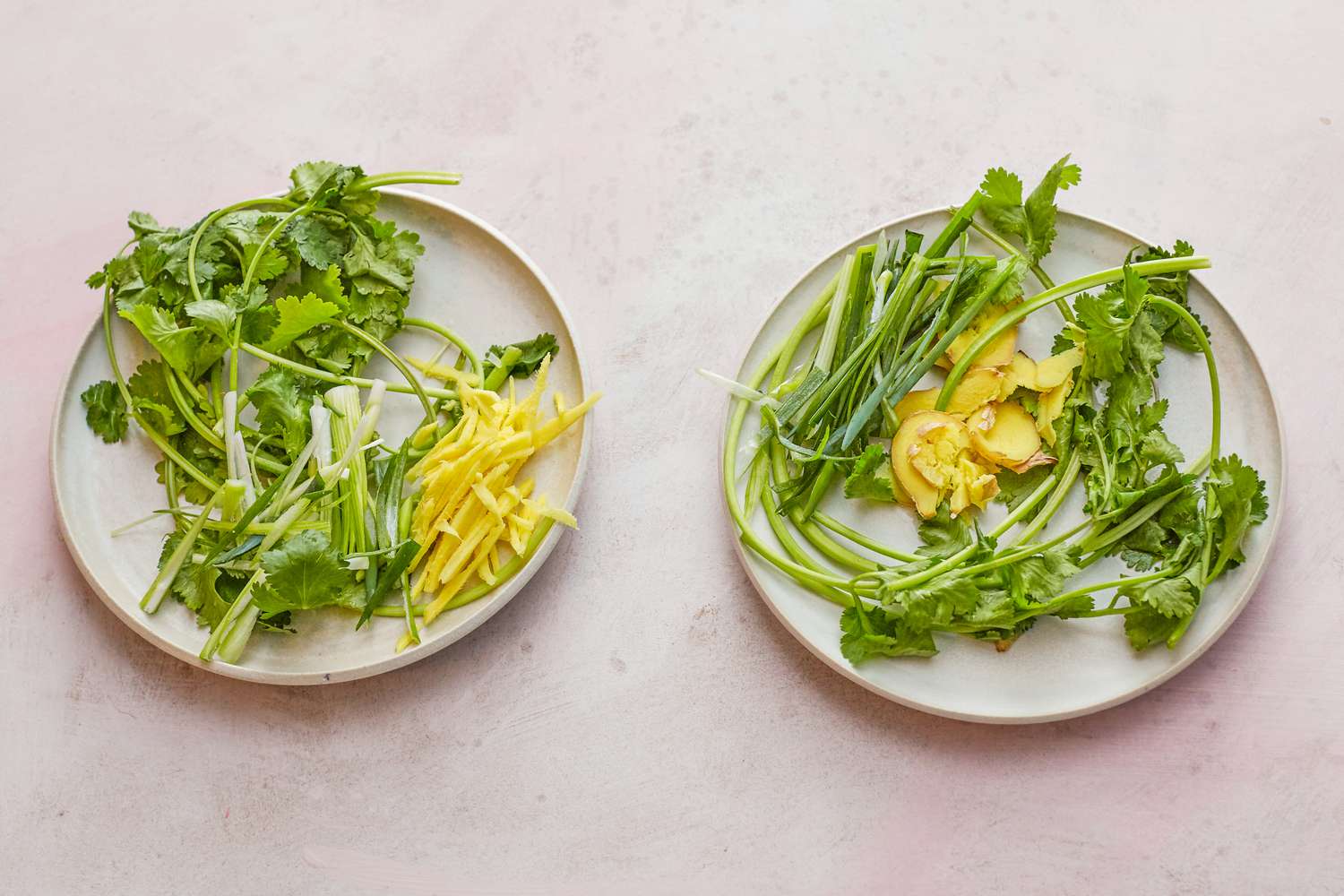 Two plates with herbs and ginger for a whole steamed fish.