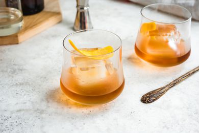 Rum Old Fashioned garnished with an orange peel