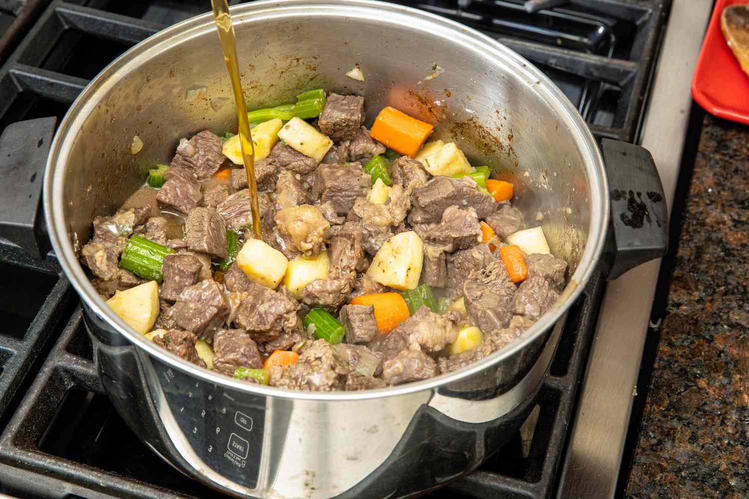 Broth Added to Pot of Easy Beef Stew on the Stove