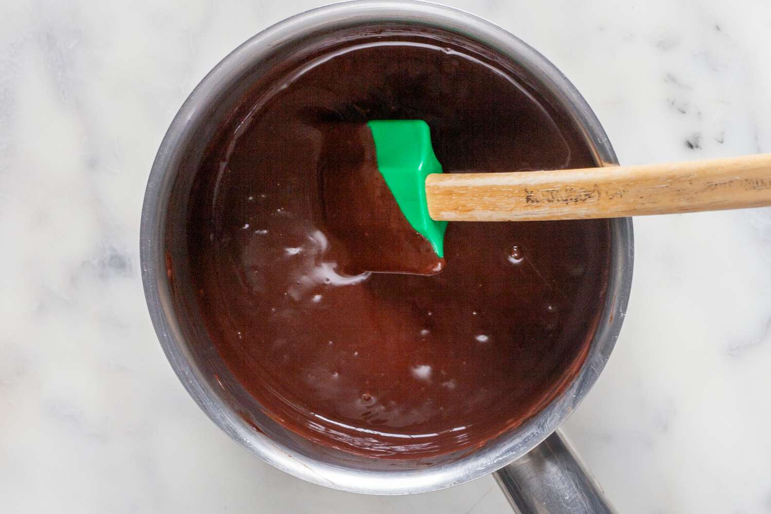 Stirring chocolate into the custard for mexican chocolate