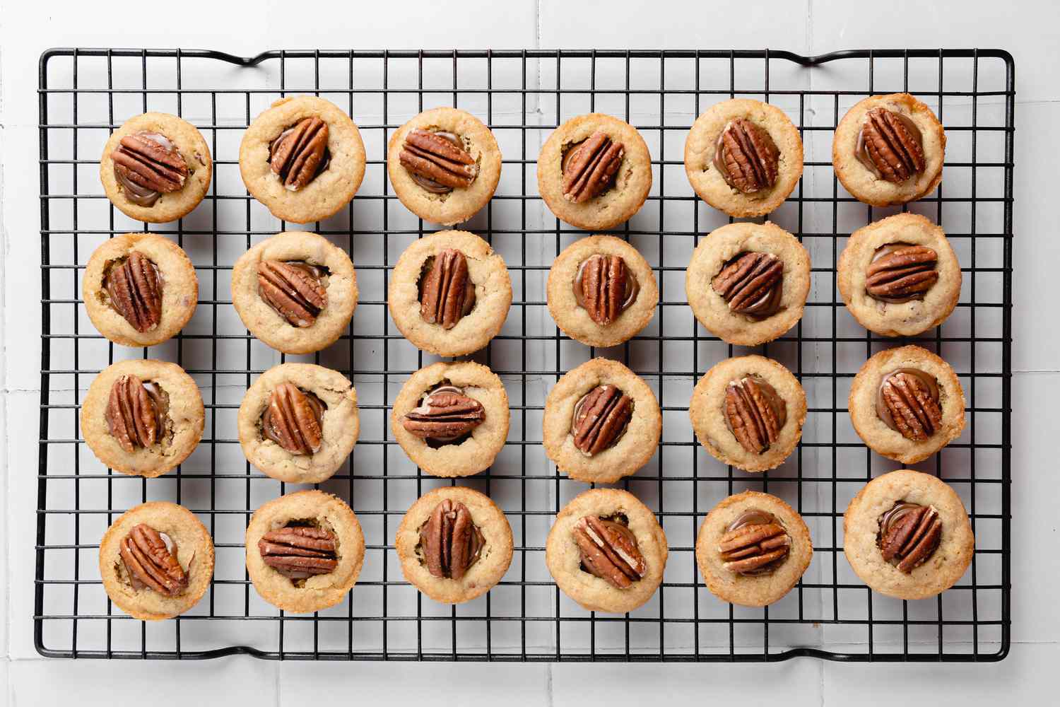Turtle Cookie Cups Cooling on a Wire Rack