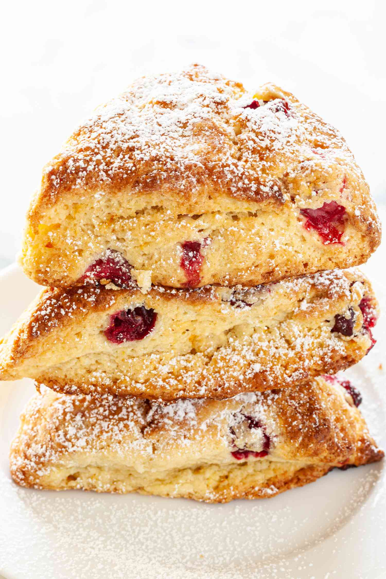 Citrus and cranberry scones stacked.