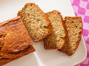5-Ingredient Blender Banana Bread on a platter, three slices cut