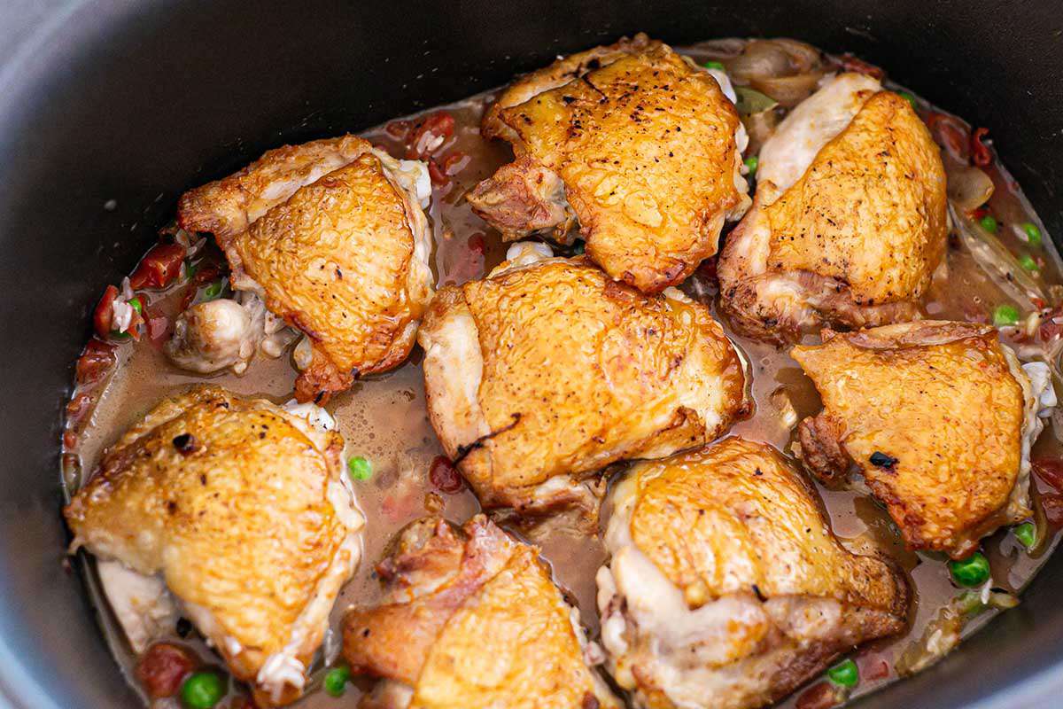 Best Crockpot Chicken and Rice Casserole add chicken to the slow cooker