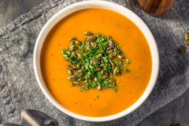 butternut squash soup in a white bowl