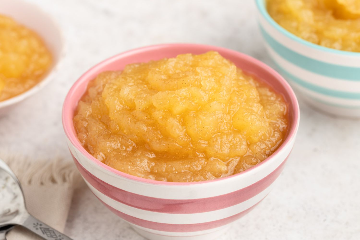 close up of small bowls of Microwave Applesauce
