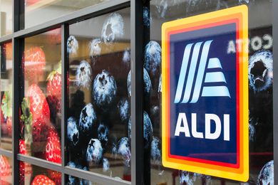 aldi sign next to front doors of the store