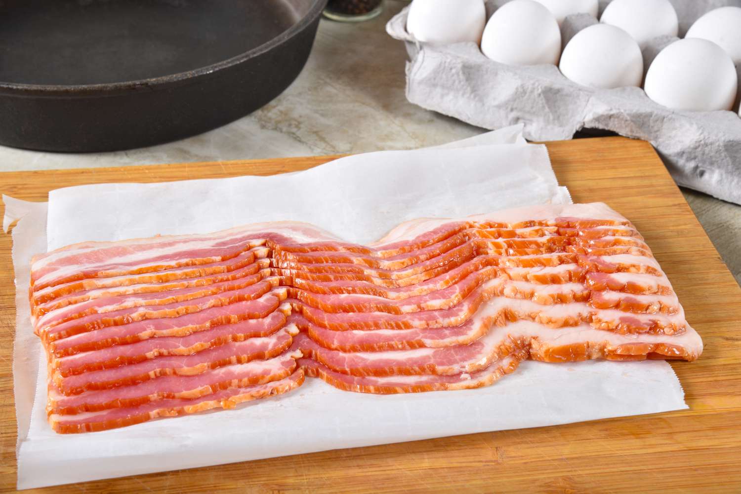 slab of bacon on a cutting board