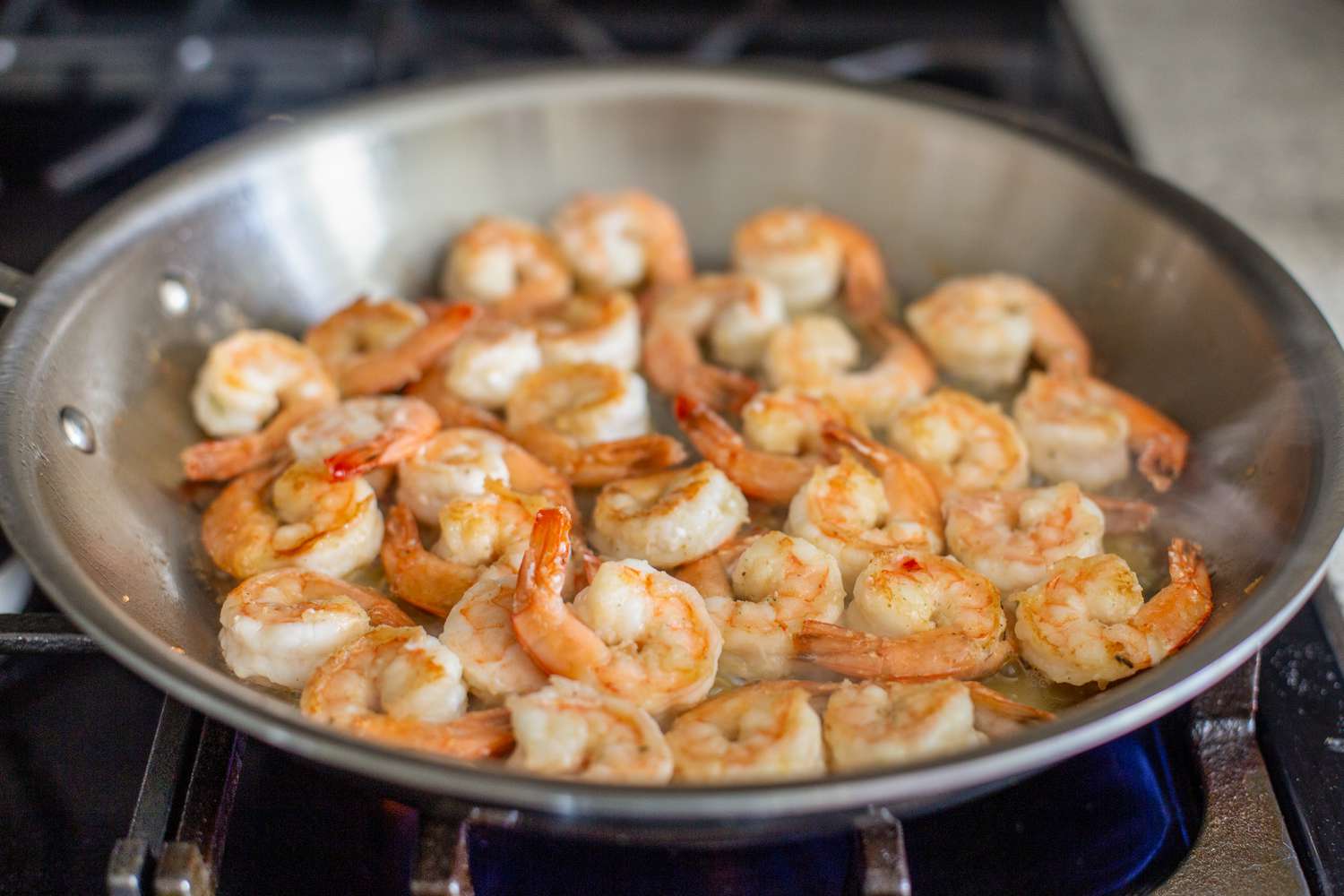 Cooked Shrimp in the Stainless Steel Pan on the Gas Stove for Pesto Shrimp With Cherry Tomatoes Recipe