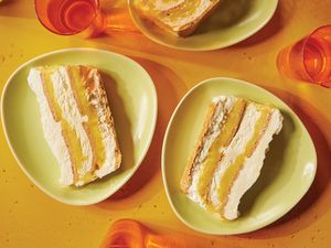 Two plates with layered dessert slices