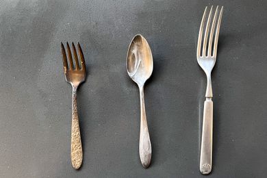 From L to R: a Tarnished Silver Fork, a Spoon With Toothpaste, and a Polished Fork on the Counter for How to Clean Silver