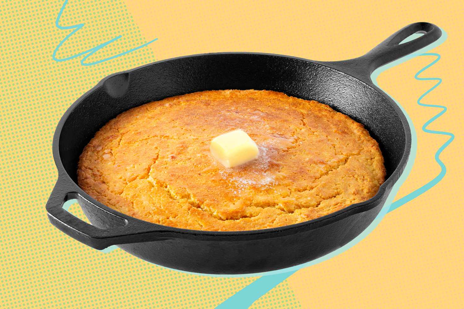 Cast iron skillet of cornbread with a pat of butter in the center on a yellow background