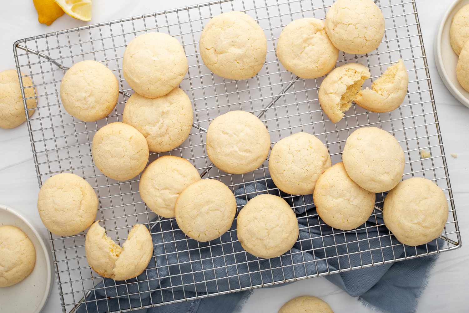 Overhead view of chewy lemon cookies on a cooling rack.