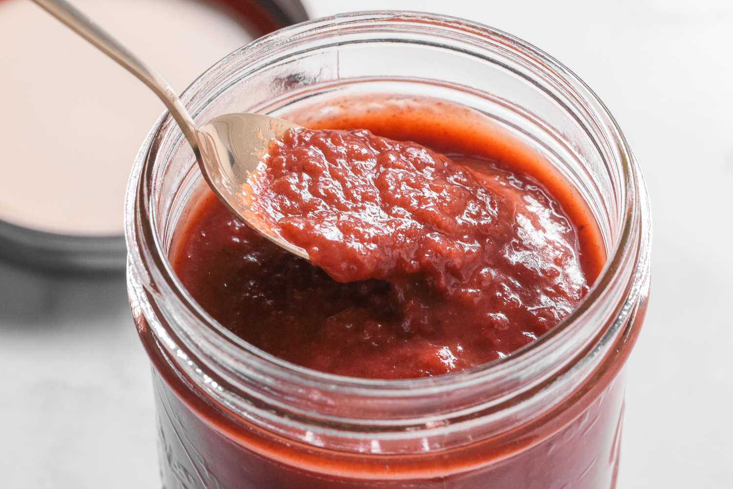 Spoonful of Banana Ketchup Lifted from Jar 