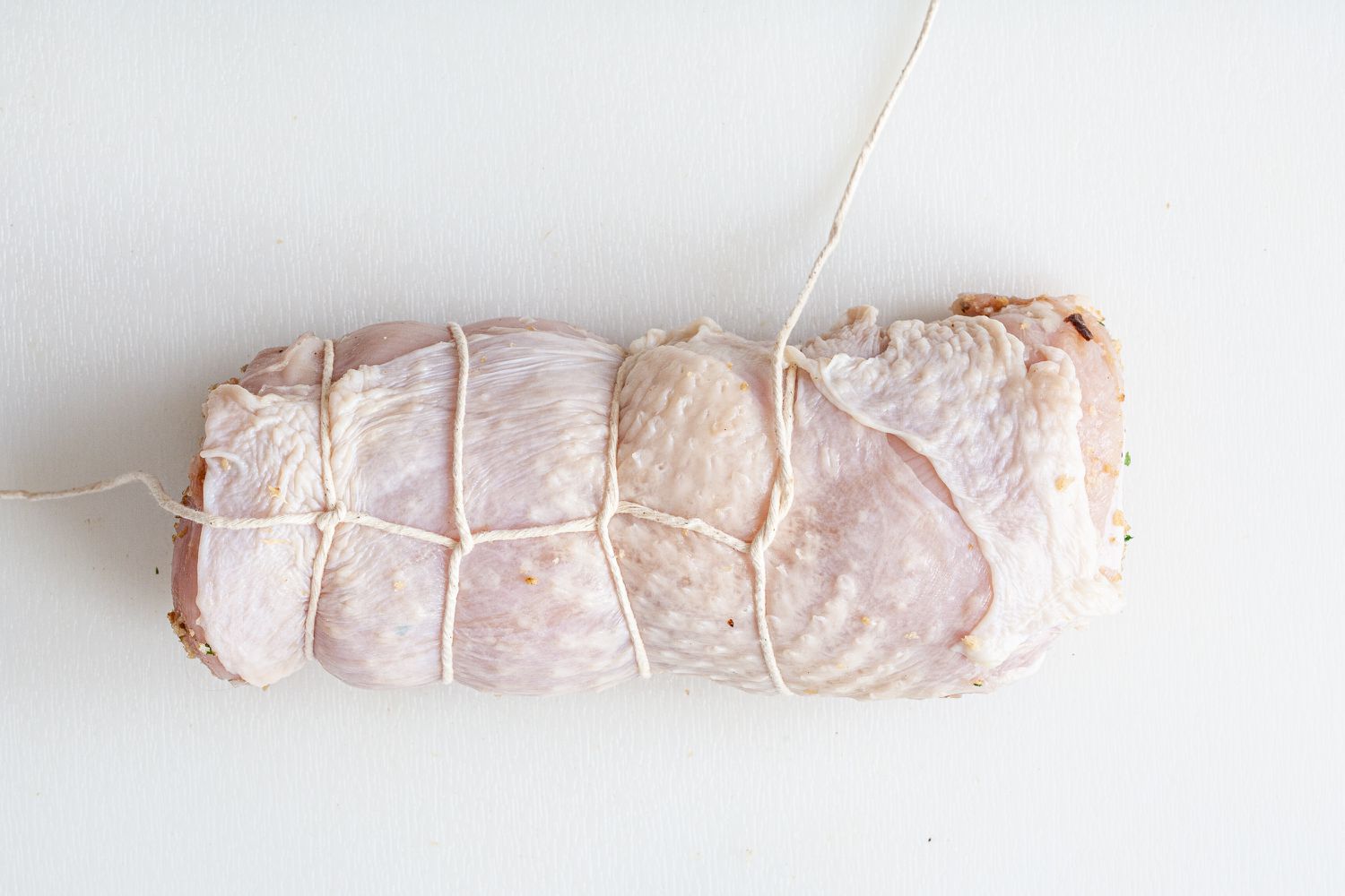 A stuffed and wrapped turkey breast to show how to stuff a turkey.