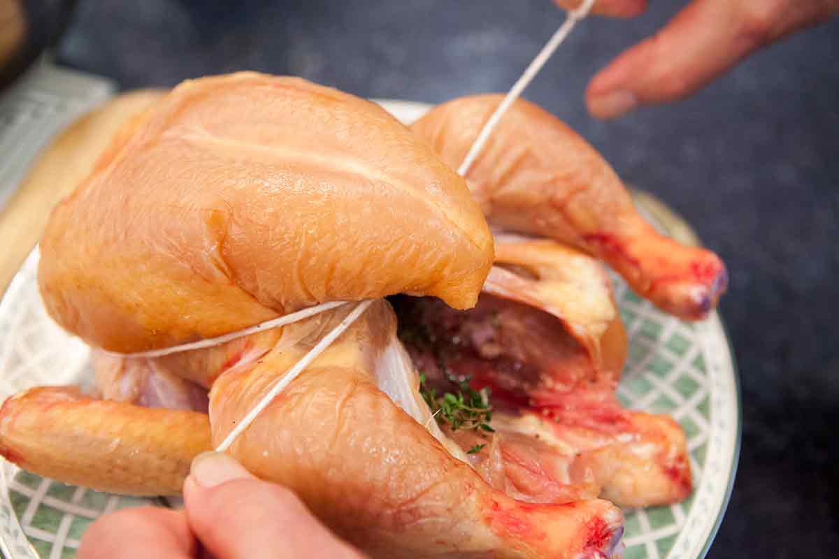 Cooking a whole chicken - truss the chicken
