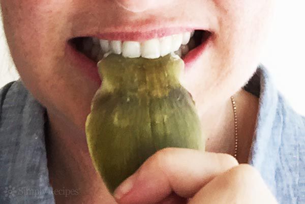 eat the artichoke by scraping the petal with your teeth