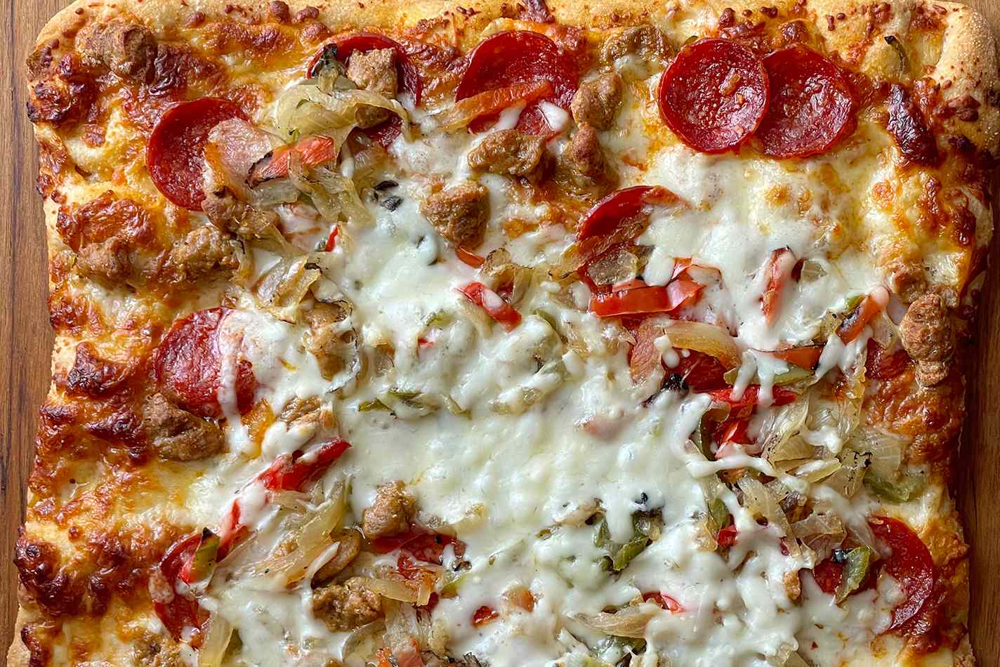 Costco take-and-bake pizza with toppings of pepperoni, sausage, and vegetables