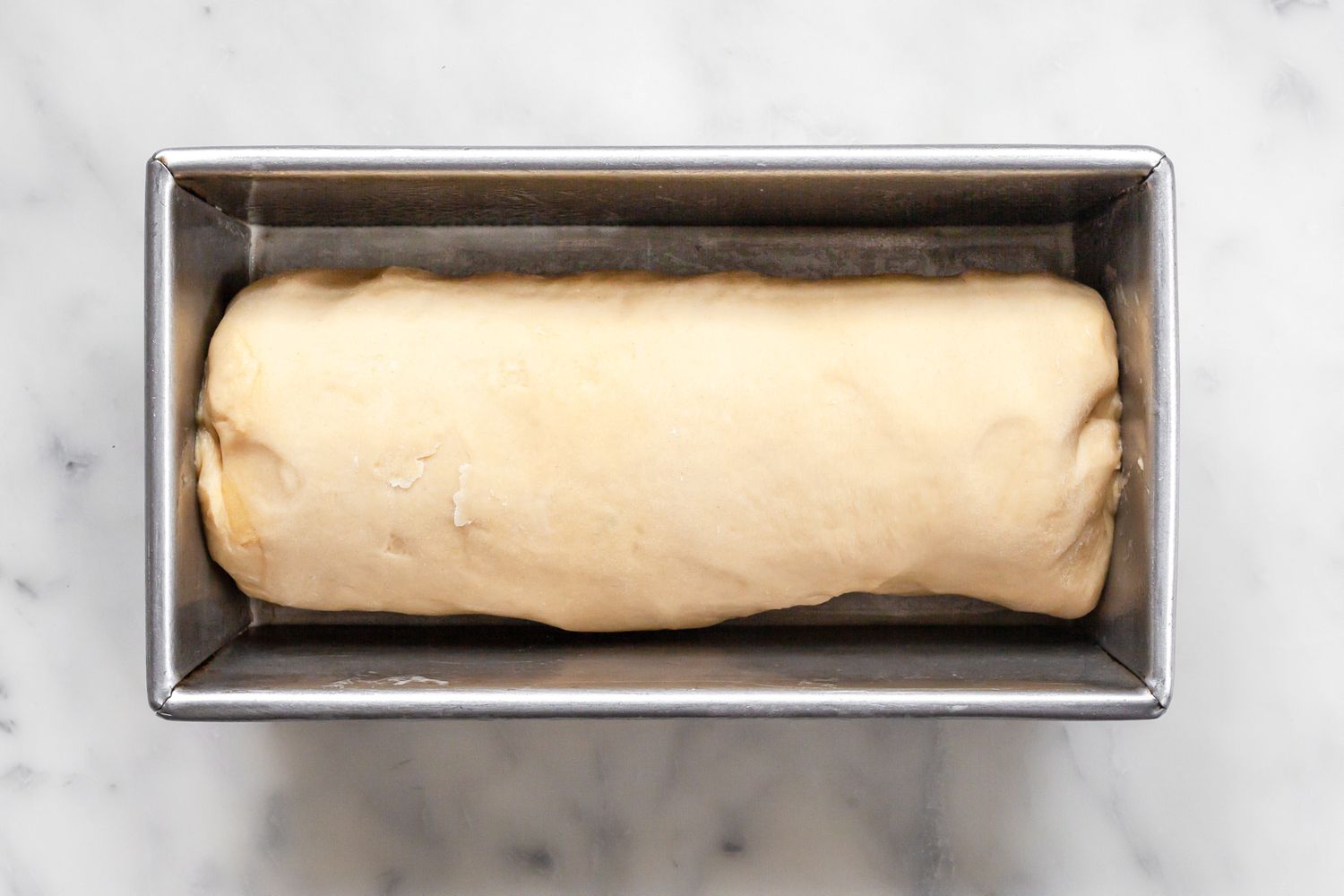 Brioche Sandwich Loaf Log Placed in a Loaf Pan