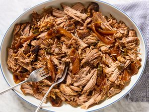 Texas-Style Pulled Pork in a large bowl with two forks