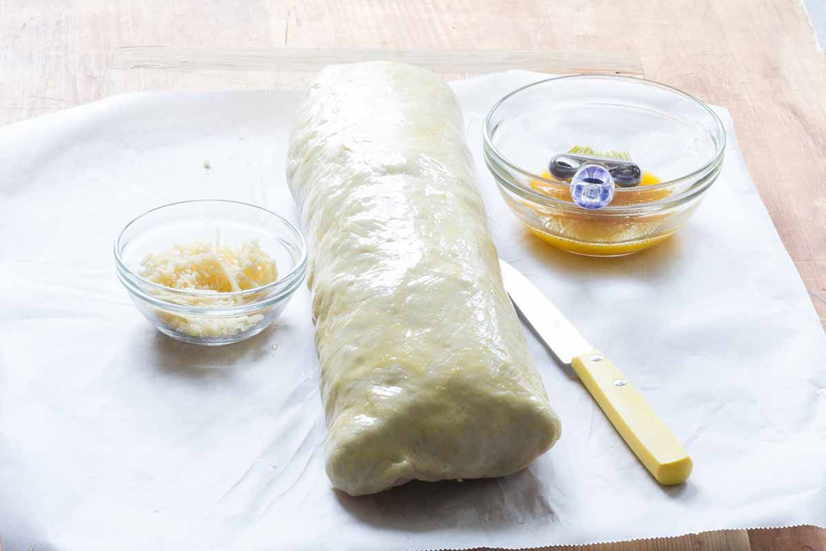 Pinch the stromboli closed and lay it seam-side down on a parchment-lined baking sheet