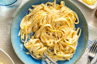 Plate of fettuccine Alfredo with a fork