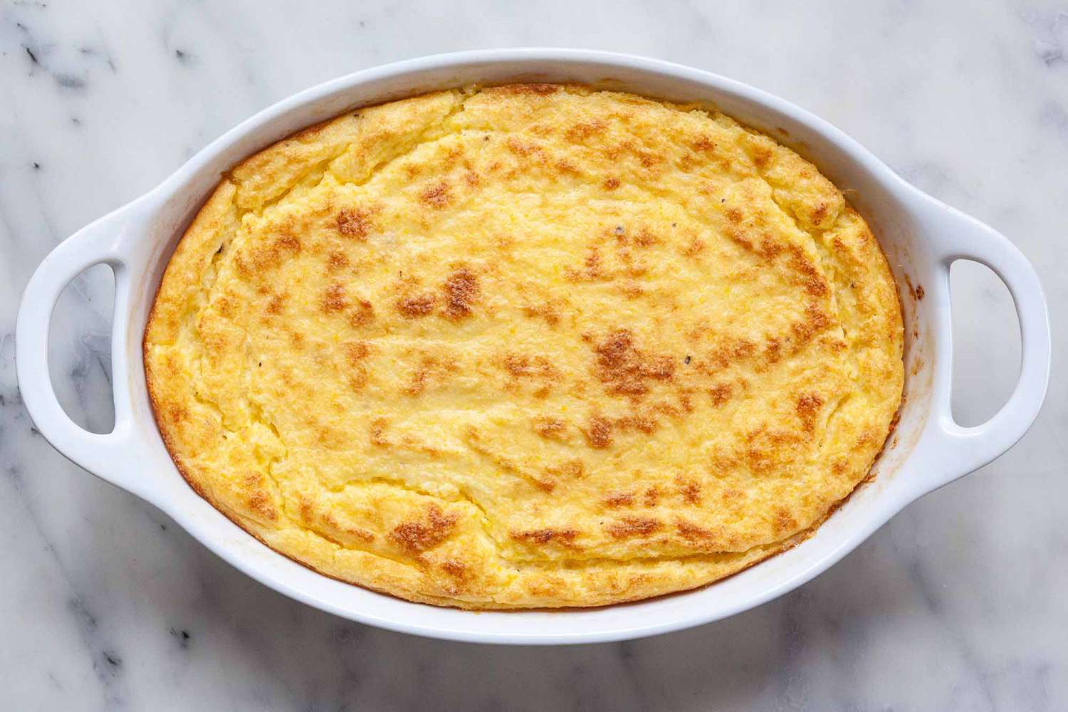 Cheese Grits Casserole - grits in white casserole dish