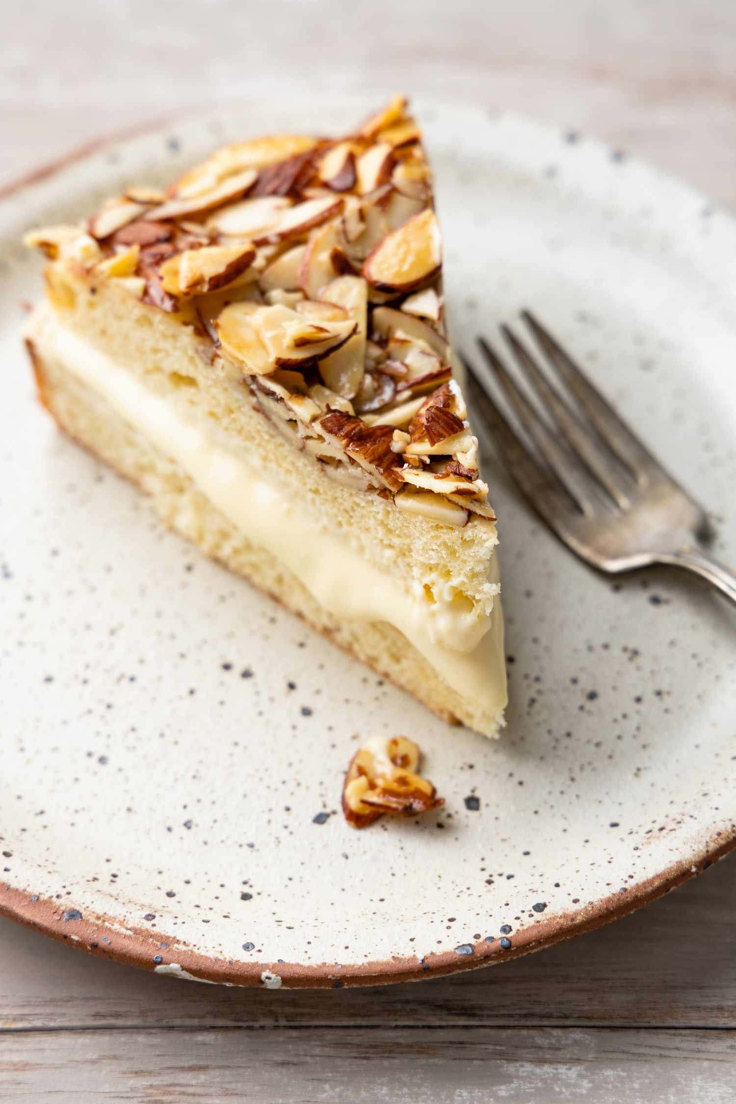 Slice of Bee Sting Cake on a Plate with a Fork
