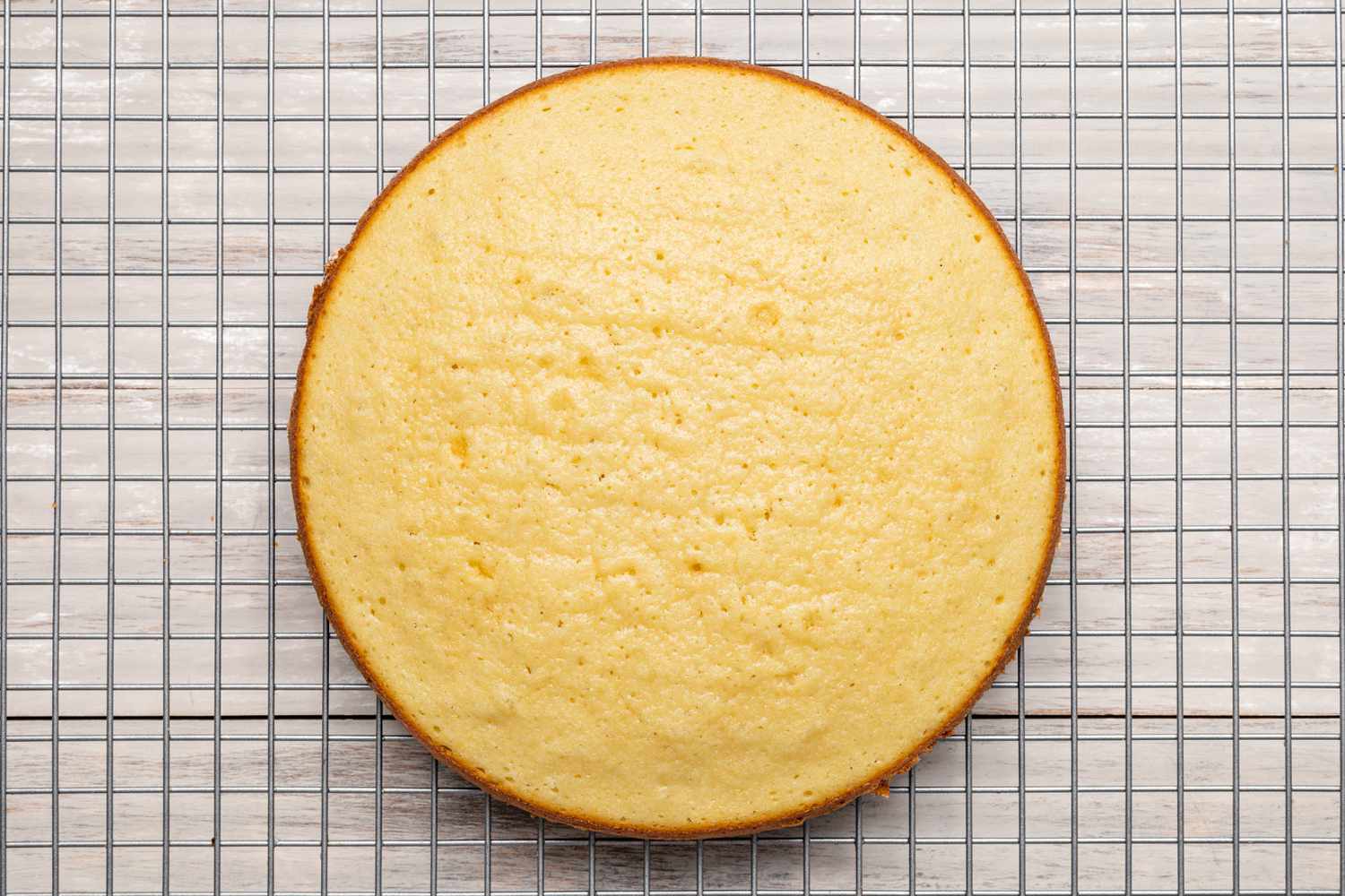 Strawberry Shortcake Cake Resting on a Wire Rack 