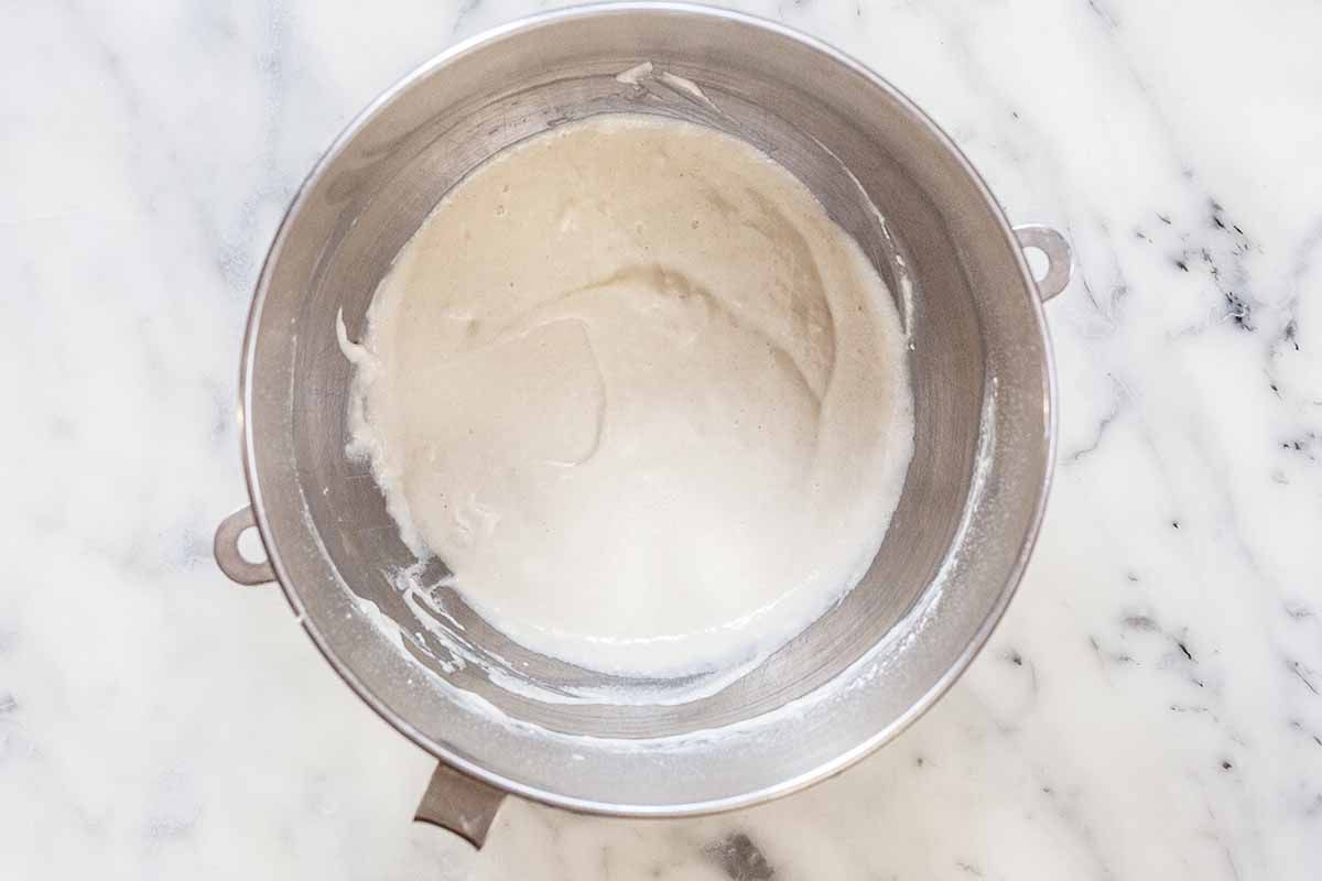 Sponge for Panettone starter in a silver mixing bowl