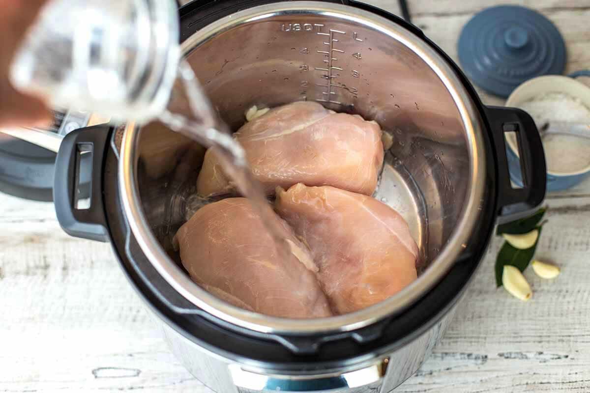 Boneless Skinless Chicken in the Pressure Cooker add the water