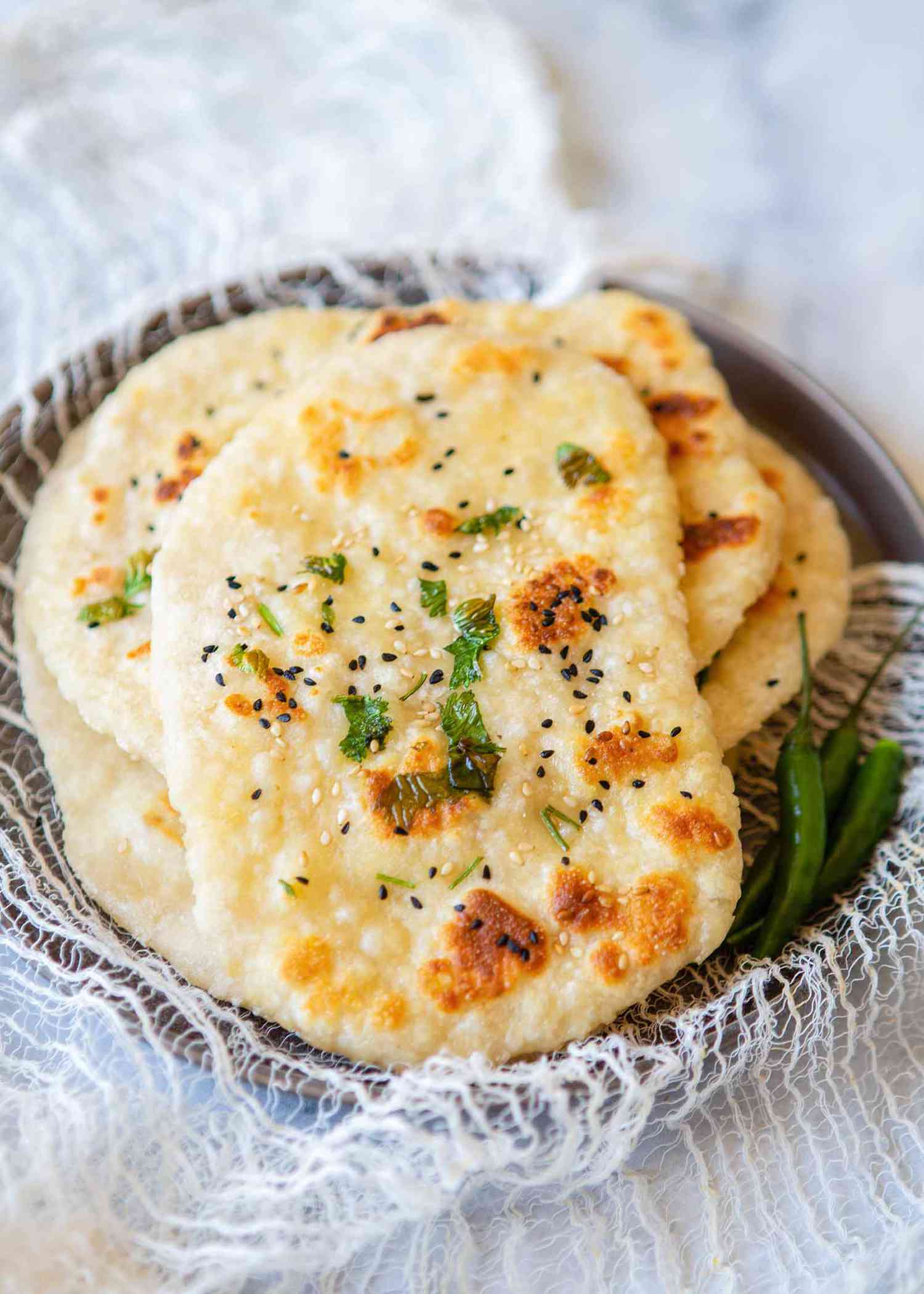 Easy Naan Bread - stacked on a plate