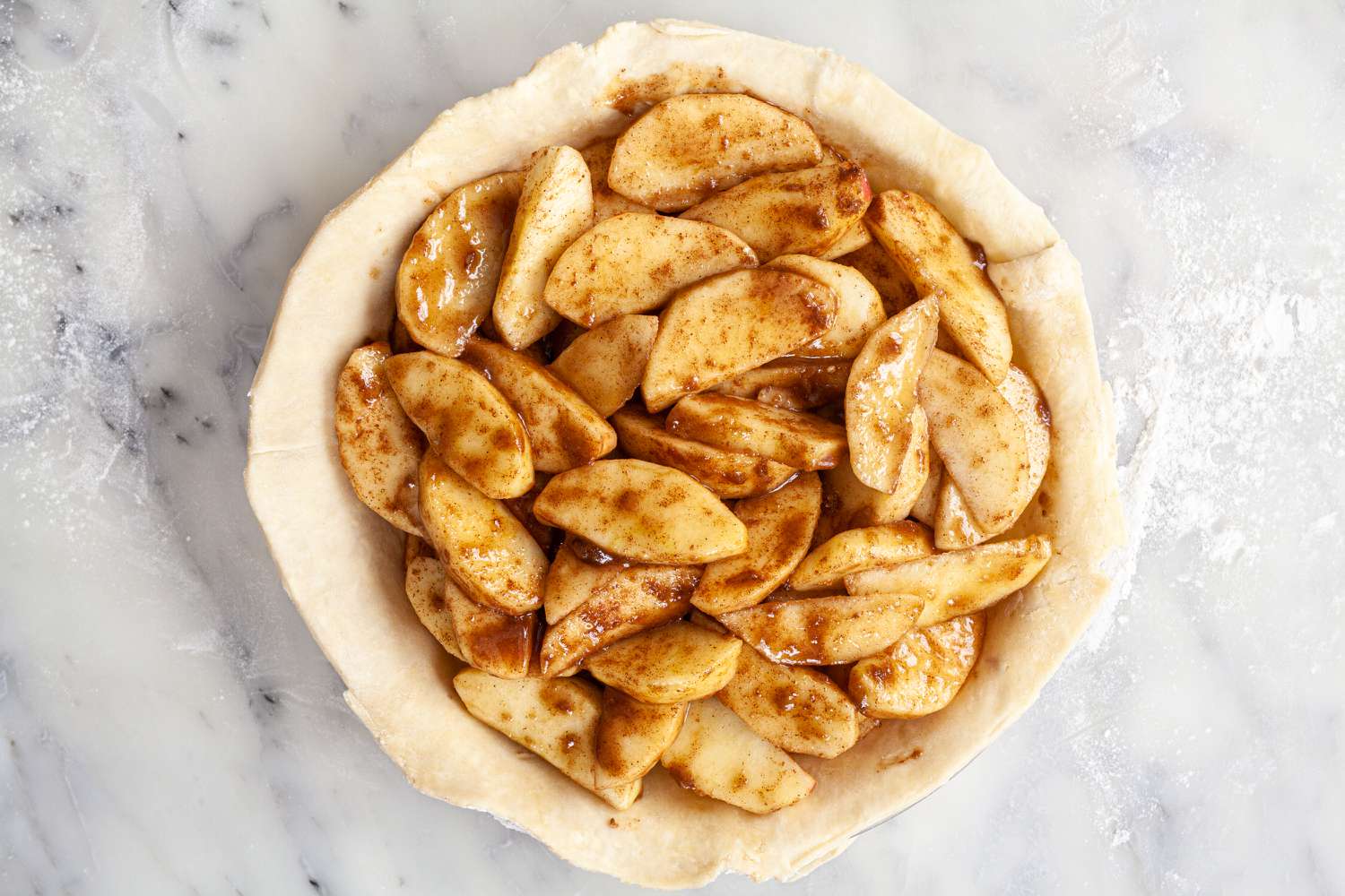 Apple pie filling the pie crust.