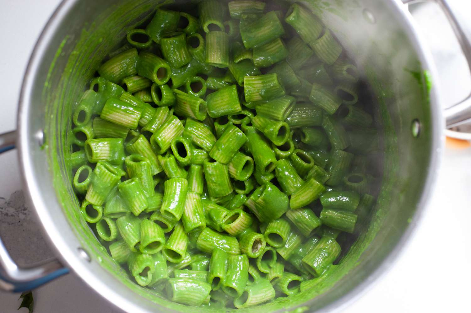 Sauce and pasta mixed in a stock pot.