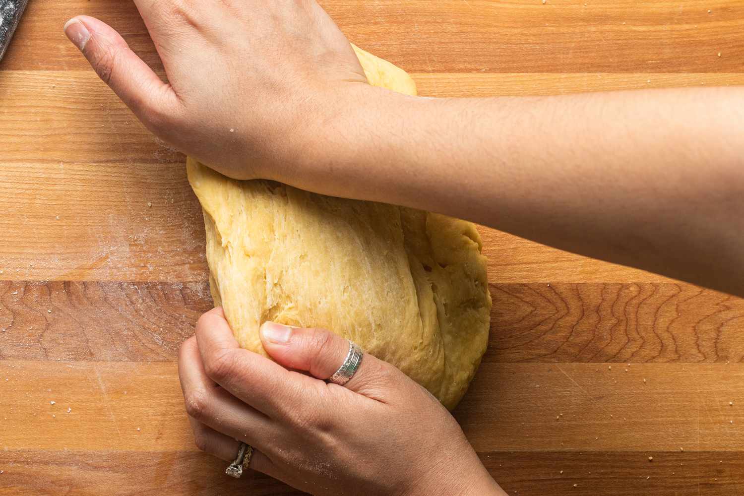 Hands Kneading the Dough