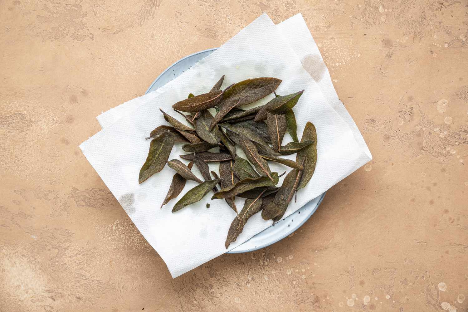 Fried Sage on a Paper Towel Lined Plate for Sage Gremolata