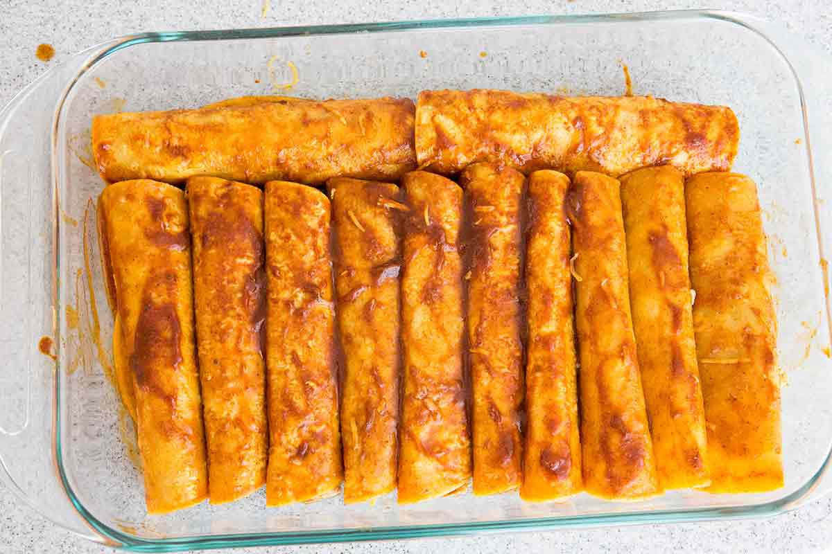 assemble the rolled up tortillas in a casserole dish for chicken enchiladas