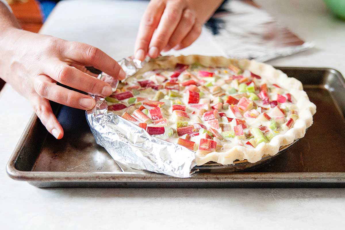 How to make rhubarb custard pie - wraping the edges of the pie with foil