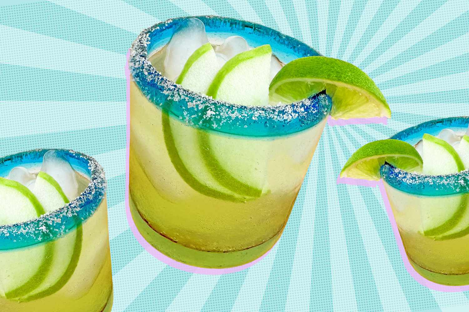 Three glasses of 3-Ingredient Sparkling Apple Margarita with slices of apple inside and salt and lime on the rim against a speckled blue background