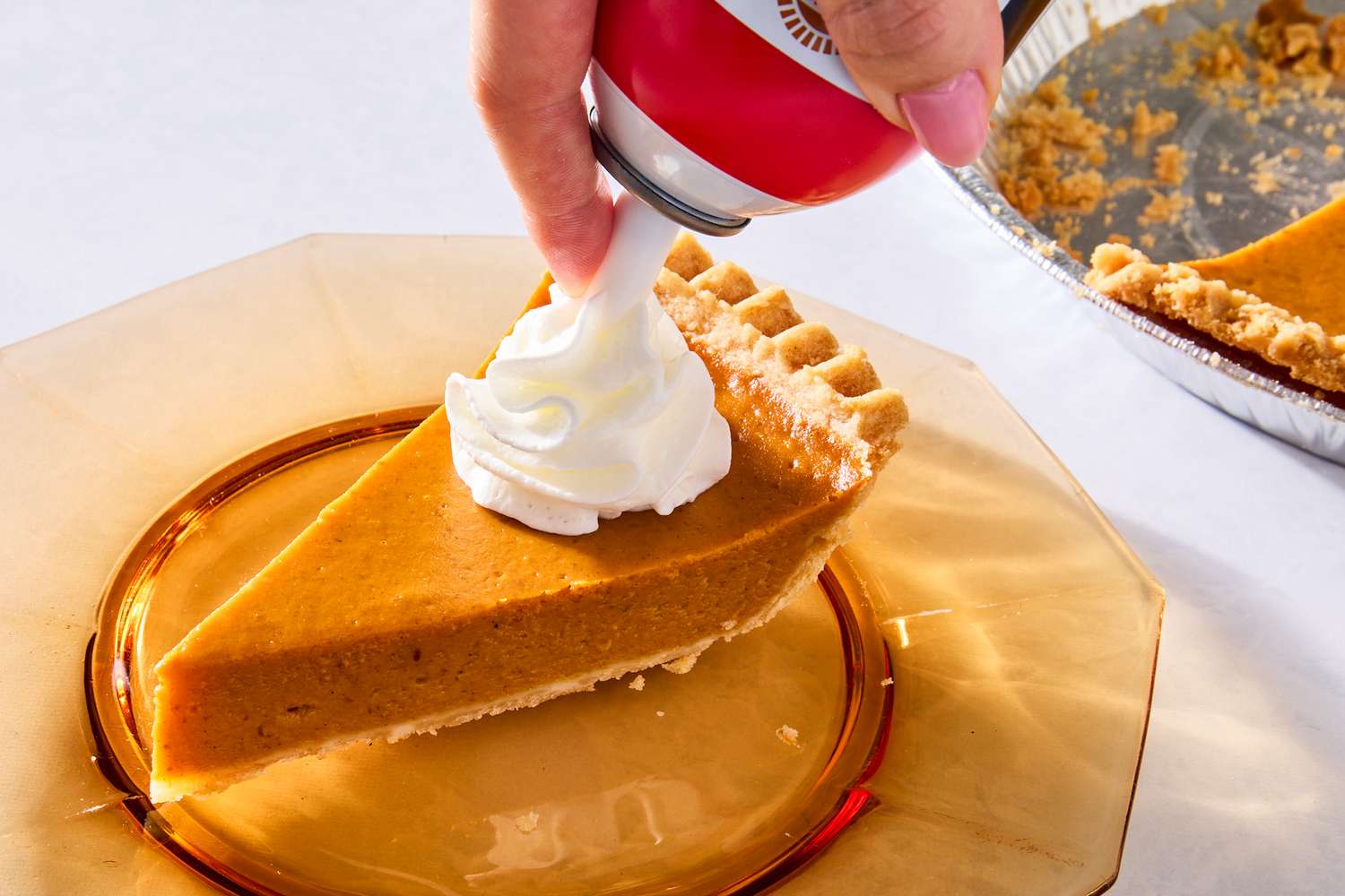 whipped cream on a pumpkin pie