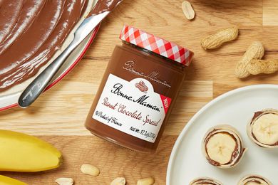 Bonne Maman Peanut Chocolate Spread jar on a wooden table