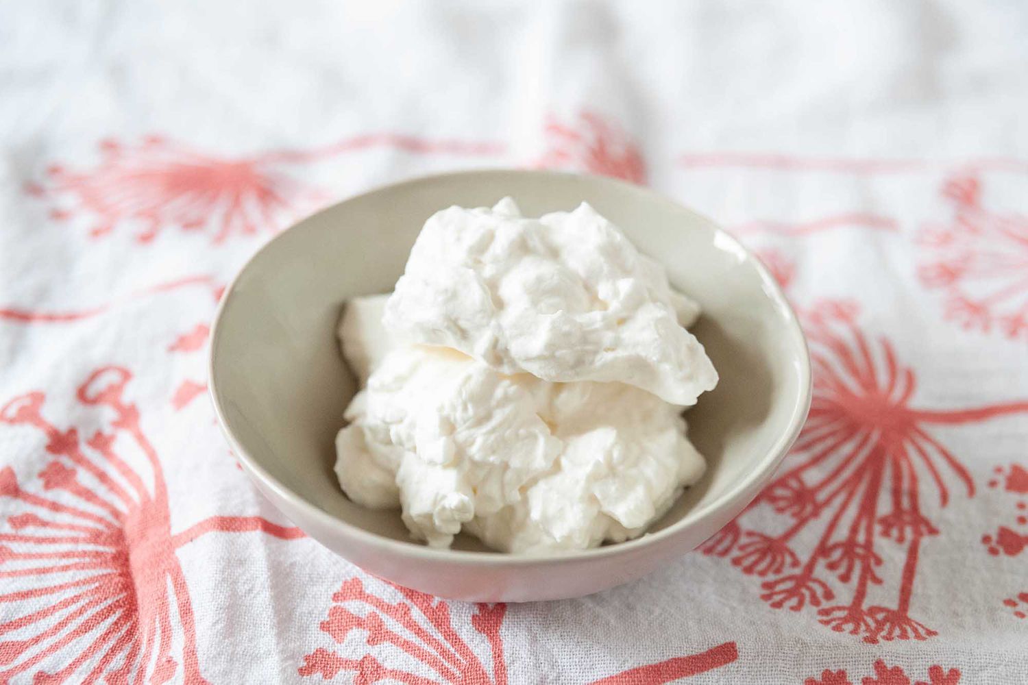 Best Homemade Whipped Cream Recipe - small bowl of overwhipped whipped cream