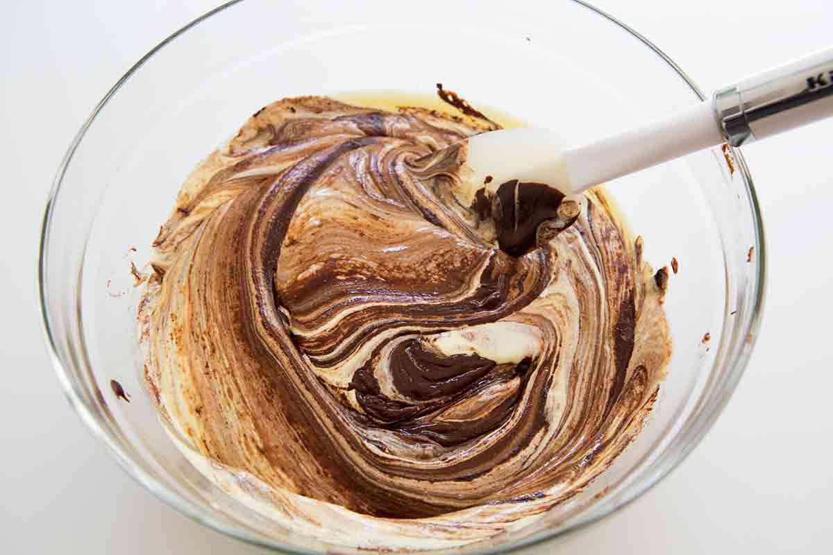 mixing chocolate and egg mixture for bittersweet chocolate cake batter