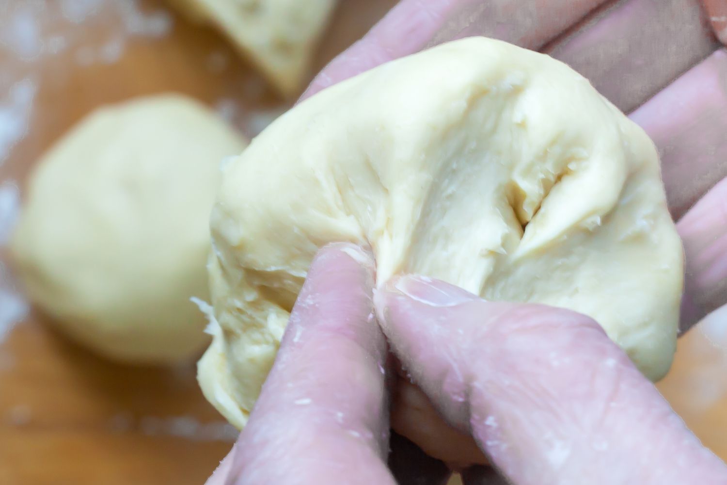 Shaping dough to make the fluffiest brioche buns.