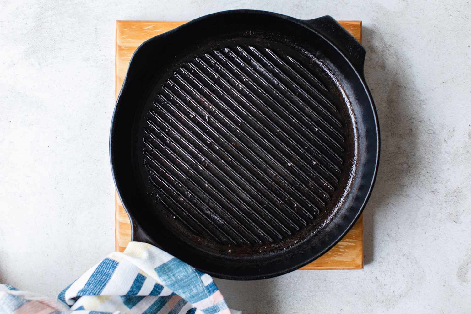Heated Cast Iron Skillet for Cheesy Skillet Cornbread Recipe