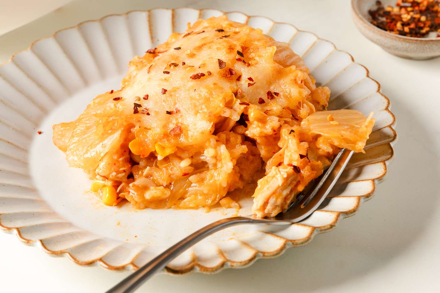 Chicken, Corn, and Tangy Cabbage Casserole on a plate with a fork