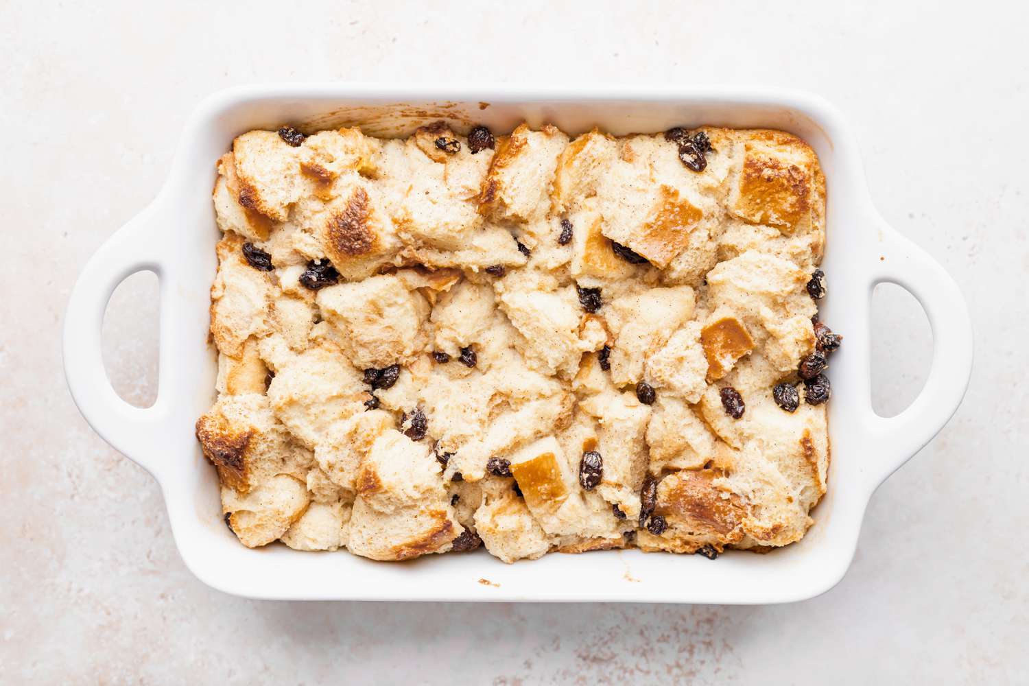 Overhead view of easy bread pudding in a white casserole dish