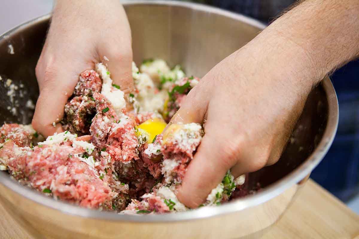 Mix together the meat mixture for the italian meatballs with your hands