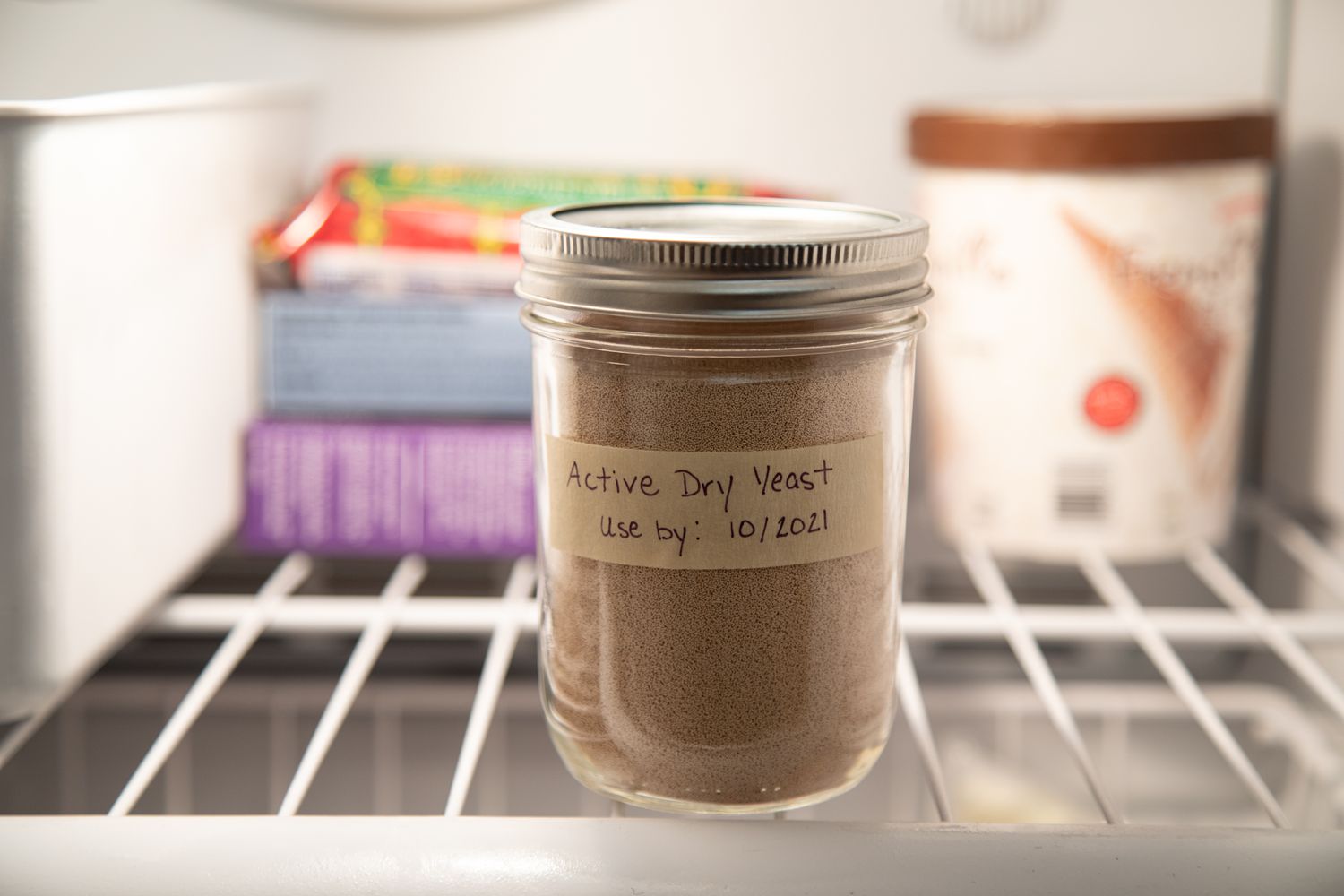 Can you store yeast in the freezer? A jar of yeast inside a freezer.