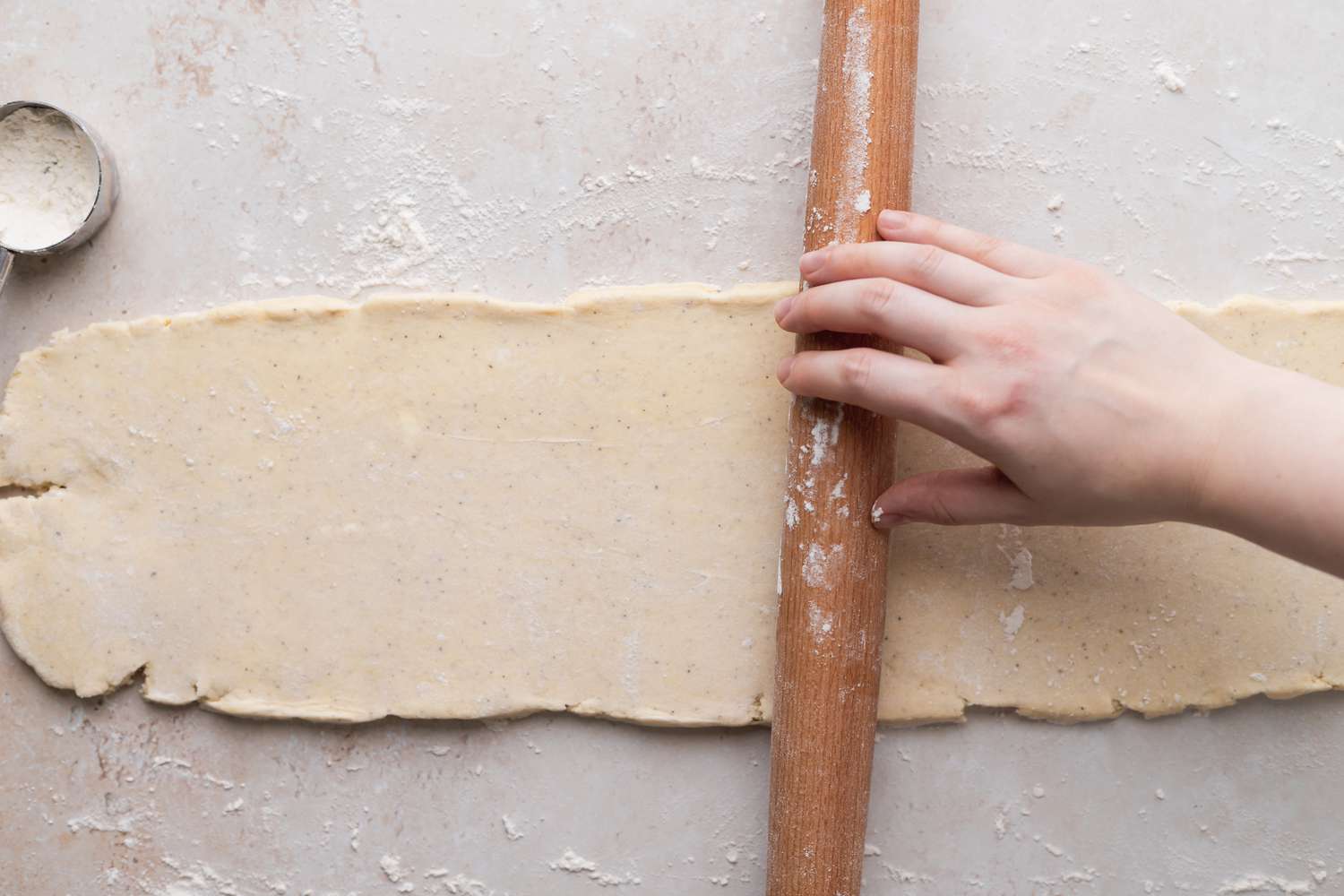 Rolling out dough to make Danish kringle (smørkringle).